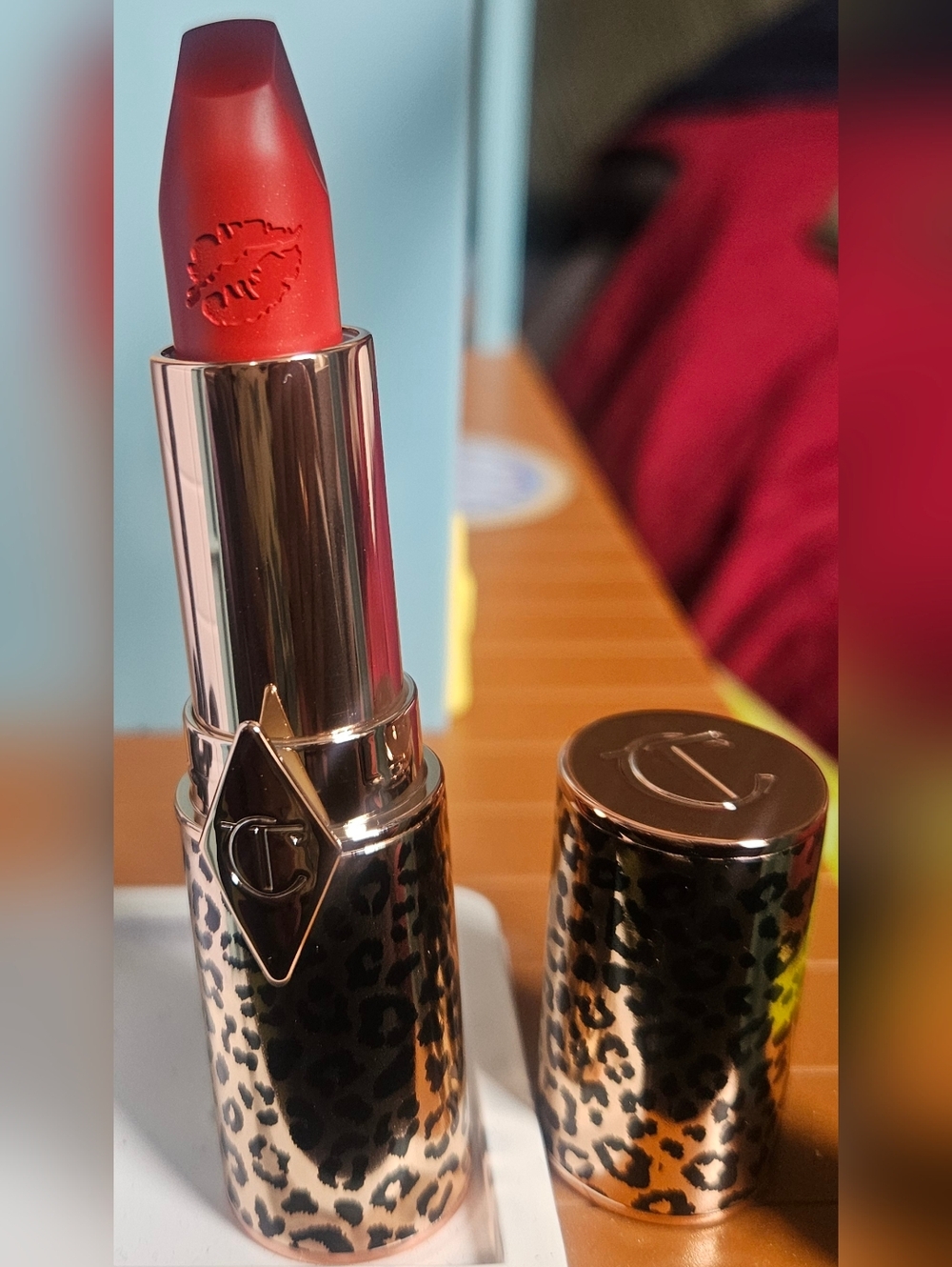 Charlotte Tilbury Lipstick in Red Hot Susan with Leopard Gold Case.